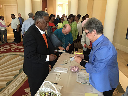 Lavond Reynolds of Windsor Springs Baptist Church in Augusta registers for the event as state missionary Phyllis Anderson, right, prepares a name tag. Reynolds serves as moderator for the Cross Cultural Commission for Augusta Baptist Association. He also oversees a homeless shelter for men and women in the city. JOE WESTBURY/Index