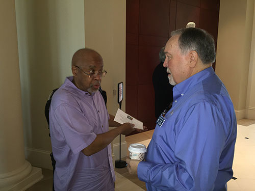 Dennis Mitchell, left, senior pastor of Greenforest Community Baptist Church in Decatur, visits with Georgia Baptist Mission Board state missionary Jerry Baker during the first annual African-American Day at the mission center. Baker leads the intercultural church planting ministry at the agency. JOE WESTBURY/Index 