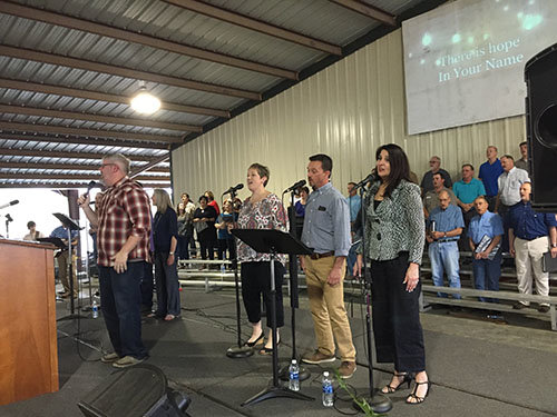 Northside Baptist Church, Tifton worship leader Brian Broome, in checkered shirt, was among the ministers adding to the revival. GERALD HARRIS/Index