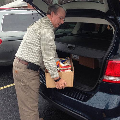 Ricky Thrasher, GBC state missionary with Church and Community Services, unloads donations to a food pantry. GEORGE CLINE/Special
