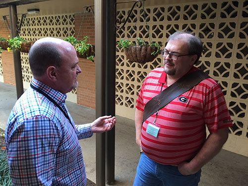 GBC President Thomas Hammond, left, visits with former missionary Mike Masters, a Rome native returning from his field in India. JOE WESTBURY/Index