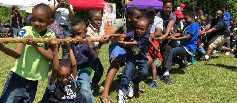 A tug of war between males and females was one of the many activities at the evangelistic block party. JOE WESTBURY/Index