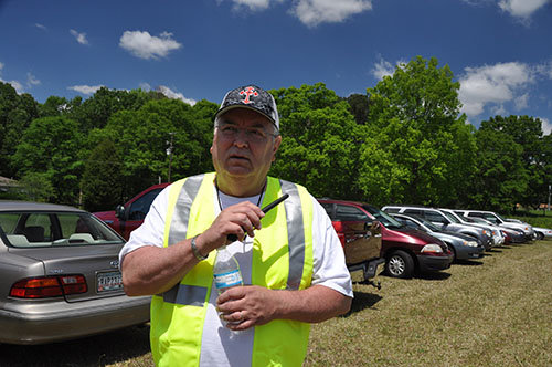 Doss Memorial pastor Bill Smith helped park cars in the noon day sun. JOE WESTBURY/Index