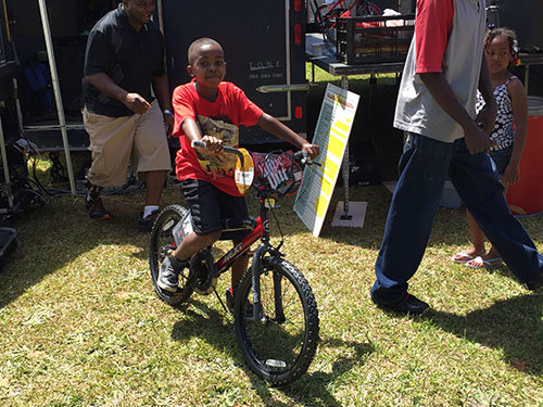 No one was happier at the block party than Zyion Edmonds on his new bike. JOE WESTBURY/Index