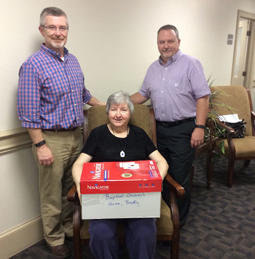 Joan Cartwright, a member of Jesup First Baptist Church, donates bath towels and wash cloths to the Baptist Children’s home in Baxley, GA. Pictured at left is First Baptist Pastor Michael Von Moss, and Earl Barron, FBC minister of education, right. FB JESUP/Special