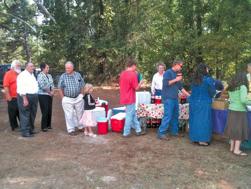 Members of both churches gather for dinner on the grounds following the joint worship service led by students from Shiloh-Newborn and a sermon by Student Pastor Paul Miller. JASON PRICE/Special