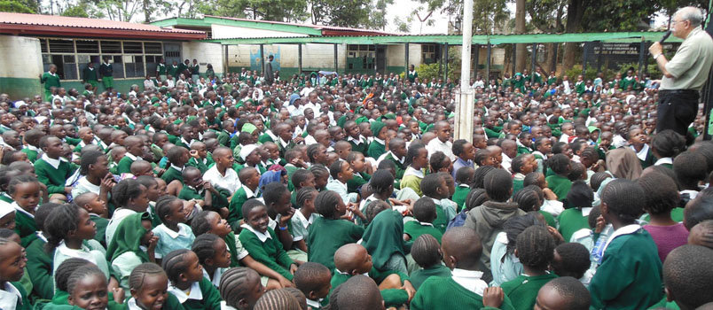 Children in a Kenyan school crowd together to hear from Naresh Malhotra. NARESH MALHOTRA/Special