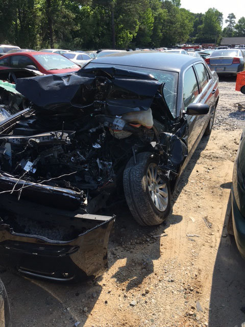 Index editor J. Gerald Harris survived the above accident last week when his car slammed into the back of a large delivery truck. 
