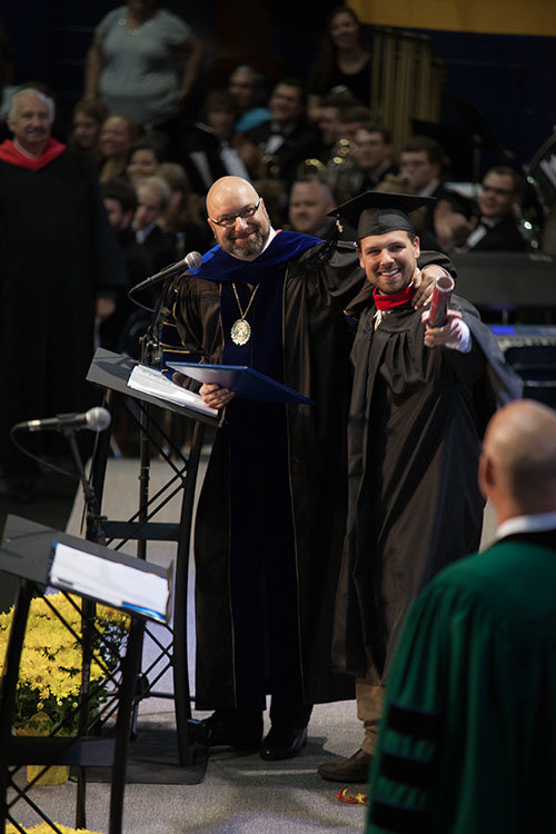 Truett-McConnell University President Emir Caner stands with Ben Garrison, the university's first master’s degree graduate. Garrison's degree is a Master of Arts in Theology. TMU/Special