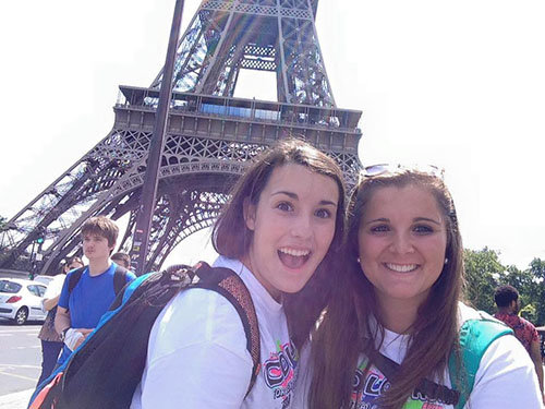 Madelyn Pruitt, right, stands with Charis Summey at the foot of the Eiffel Tower in Paris while on a 2015 youth mission trip to Turkey. FB EASTMAN/Special