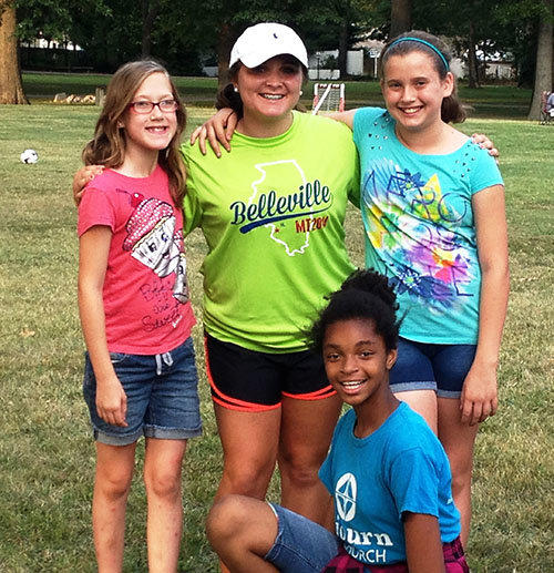 While on a 2014 mission trip to Belleville, IL, Madelyn Pruitt pauses with some new friends. FB EASTMAN/Special