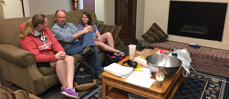 Jenkins relaxes with Ansley Strickland, a member of Morningside Baptist Church in Columbus, left, with Meagan Cordoran, a member of Oshichee Baptist Church across the state line in Alabama, in the BCM lobby during final exam week. JOE WESTBURY/Index