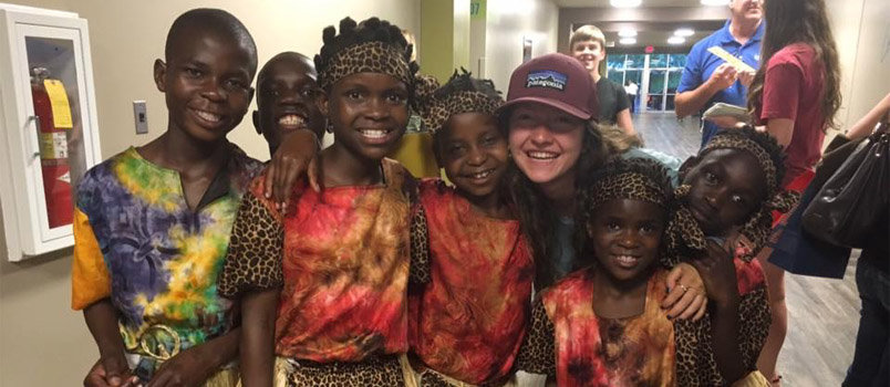 Brinley Harris quickly connected with these children who came to her church from Uganda. 