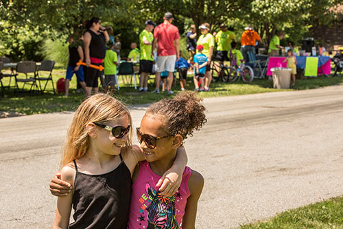 Ava Evans, age 8, (left) and her cousin Kay Harrell enjoy hanging out at a block party hosted by Canaan Baptist Church in Imperial, Mo., on Saturday, June 11. The block party was part of Crossover St. Louis 2016, held prior to the annual meeting of the Southern Baptist Convention June 14-15 at America's Center in St. Louis. CHRIS CARTER/Special