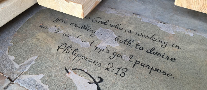 Church 213's foundational scripture verse of Philippians 2:13 was painted on the floor when the concrete was laid and will undergo touch-up before the flooring is laid in the entrance. JOE WESTBURY/Index