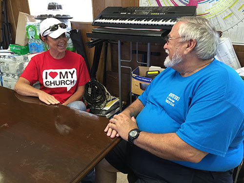 Holly Hayes of Church 213 and Ken Brooks of First Cochran discuss the week's timeline during a mid-June work week. JOE WESTBURY/Index