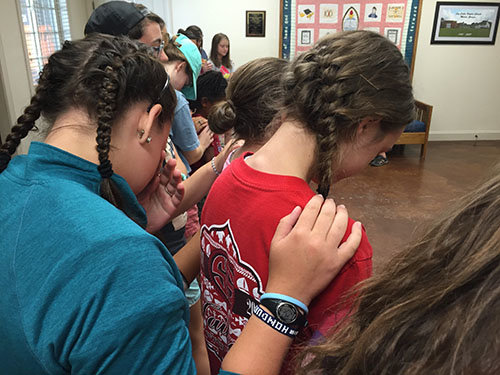 At the conclusion of Catherman's discussion each girl was prayed for individually by camp staffers. JOE WESTBURY/Index