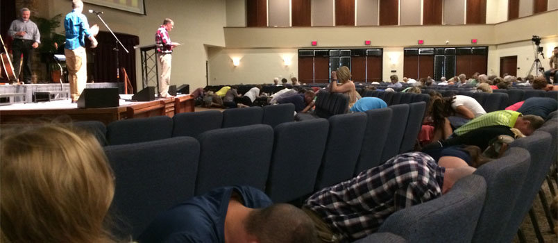 Members of Cartersville First Baptist Church pray in their seats during a special prayer time called by Pastor Jeremy Morton to address racism and peace in the country. SCOTT BARKLEY/Special