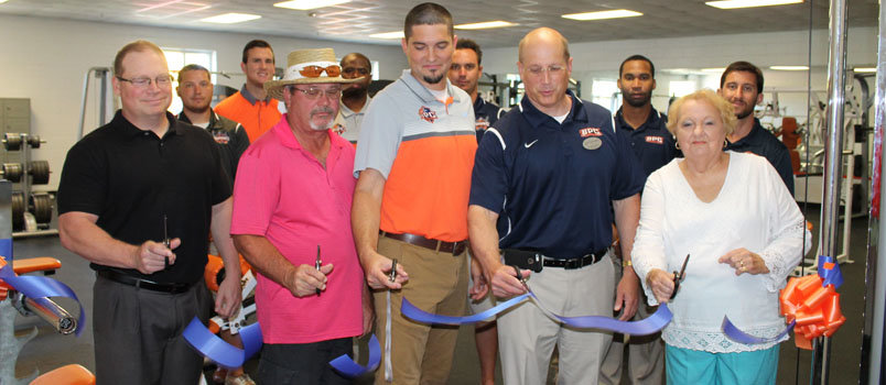 Brewton-Parker President Steve Echols (in front, blue shirt) and Vice President for Athletics and Student Development Daniel Prevett (in front, orange shirt) join trustees, administrators, staff, and community members July 23 to celebrate the grand re-opening of the college’s Community Abundant Life and Wellness Program. MANDY CORBIN/BPC