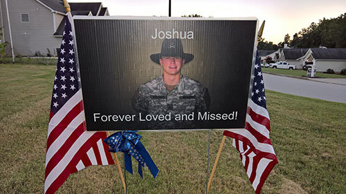 A memorial to Joshua Dingler stands in the front yard of his parents, Tommy and Karen, who live in Hiram. TOMMY DINGLER/Facebook