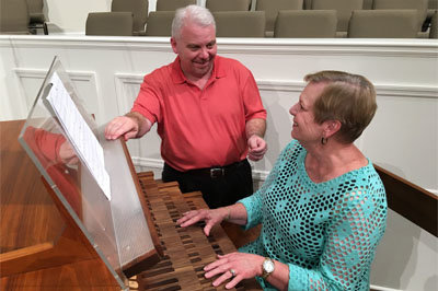 Andy Daughtry, minister of music at First Baptist Thomasville, stands with Margaret Grady over the church's recently-restored organ. On Sept. 25 First Thomasville will honor Grady's 50 years as church organist. FIRST THOMASVILLE/Special