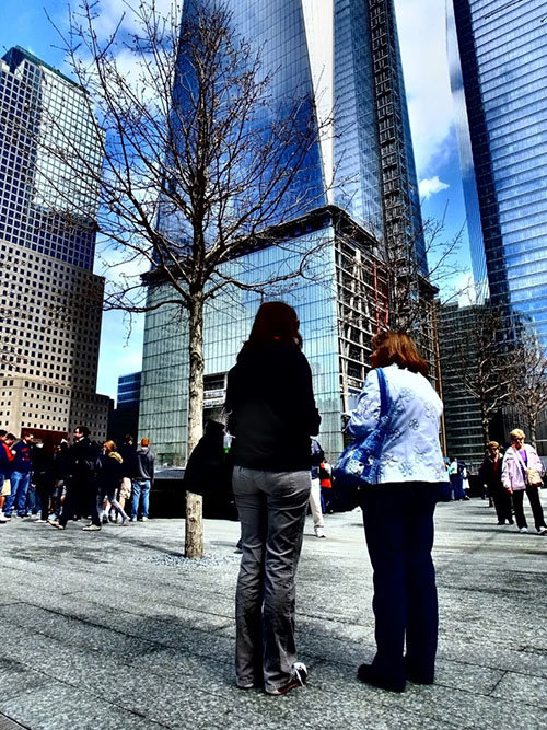 Katie Thompson stands with a friend in the shadow of the new World Trade Center complex. NCC/Special