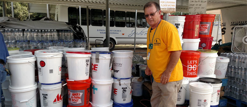 Georgia Baptist Disaster Relief volunteer Rhett Spires looks over Buckets of Care collected for Louisiana residents. CINDY GREENWELL/Special