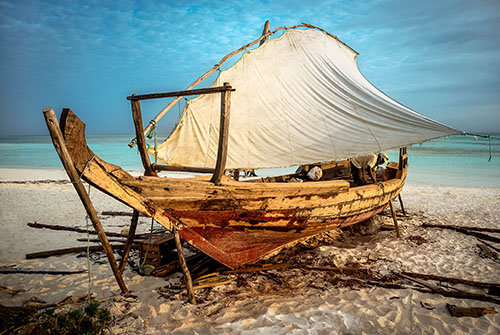 Stanley took a photo of this battered sailboat on an island off the coast of Zanzibar and predicted that it would sail again.