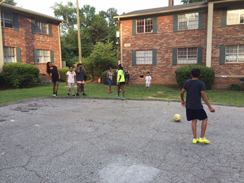 Kids play games as part of the weekly Bible study that Gibbs and his volunteers organize at local apartment complexes. STEVE GIBBS/Special