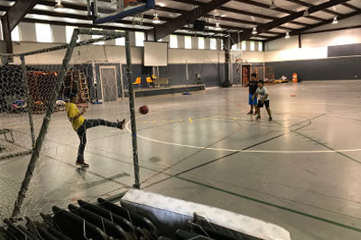 Children from Savannah pass the time in the Lilburn gym while adults follow weather reports back home. JOE WESTBURY/Index