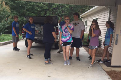 Teens from Dudley Baptist gather at the Laurens Baptist Association office over the weekend to assemble food boxes for evacuees coming down the I-16 Corridor between Savannah and Macon. DUDLEY BAPTIST/Special