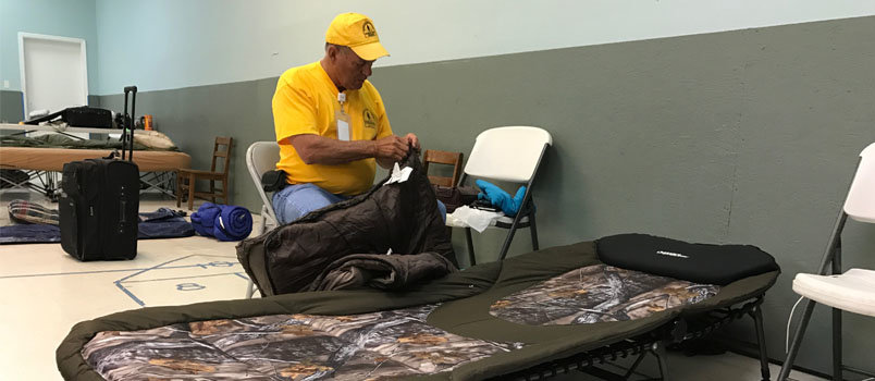 Robert Goff of Trenton Baptist First Church in Dade County unzips his sleeping bag to bed down for the night at the shelter at Savannah Baptist Association. JOE WESTBURY/Index