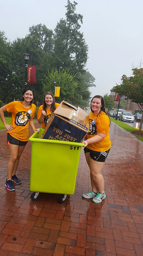 Ashley McCurley, Lexi Rabun of Dry Valley Baptist Church in Somerville, and BCM President Taylor Boggus of Jasper help move freshmen into the Armstrong State dorms this fall. ARMSTRONG STATE BCM/Special