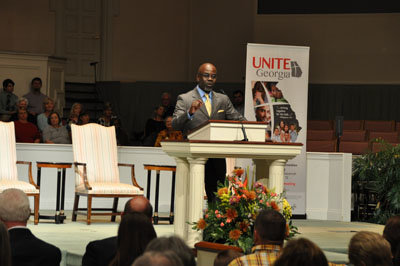 Calvary Baptist Temple Pastor Kenny Grant welcomes messengers and guests to the Inspirational Rally. Calvary serves as host church for this year's annual meeting. JOE WESTBURY/Index