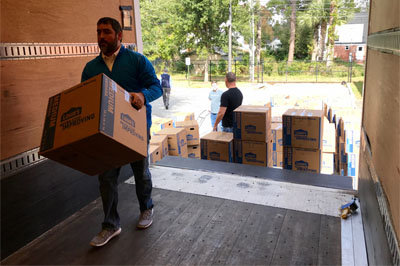 Keith Wade, campus minister at the University of North Georgia in Dahlonega, loads boxes of backpacks bound for needy children in Appalachia. The backpacks are being transported in an 18-wheeler provided by the North American Mission Board who oversees Appalachian Regional Ministries. JOE WESTBURY/Index