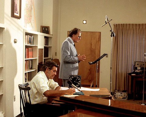 Cliff Barrows directs The Hour of Decision radio show in a recording studio with Billy Graham. BGEA/Special