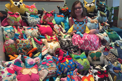 Melinda Kaye Mercer, eight years old, has sewn 60 stuffed owls as a personal contribution to the Backpacks for Appalachia outreach. MERCER FAMILY/Special