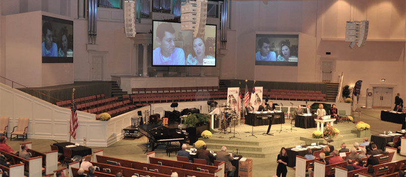 Messengers listen in on a live Sype phone call from Georgia Baptist missionaries Craig and Katie Nalls in Mozambique during the WMU missions report. JOE WESTBURY/Index