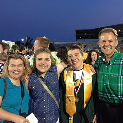 Mark and Susan Williams stand with their children, Emily and David, at David's graduation from Ware County High School. David is set to graduate from Valdosta State University next week. WILLIAMS FAMILY/Special