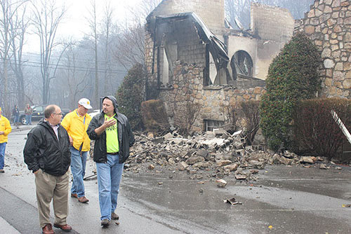 Kim McCroskey, right, pastor of Roaring Forks Baptist Church in Gatlinburg, describes the destruction of the church’s facility to Joe Sorah of the Tennessee Baptist Mission Board staff. Wes Jones, Tennessee Baptist Disaster Relief specialist, stands in the background. BAPTIST AND REFLECTOR/Special