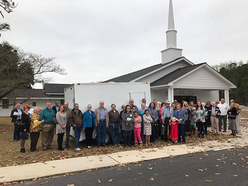 Red Oak Baptist Church members stand in front of the enclosed trailer purchased for Tapestry Church in Atlanta. Support from congregations like Red Oak have been instrumental for Tapestry, says co-pastor Kris Parker. "We super-love these small churches in rural areas of the state that are involved in missions," he said.