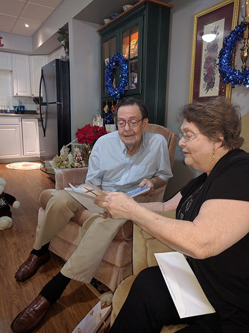 Bethea and Sandra Fielding read the Christmas card from Georgia Baptist state missionaries that was included in the gift bag. The couple moved into their new basement apartment provided by Woodstock Baptist Church and Johnson Ferry Baptist Church in September. KEITH HAMILTON/Georgia Baptist Mission Board