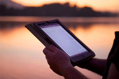 A tablet is read at sunrise. Wycliffe Associates plans on flooding persecuted areas with similar tablets containing the Bible in the upcoming year. GETTY/Special