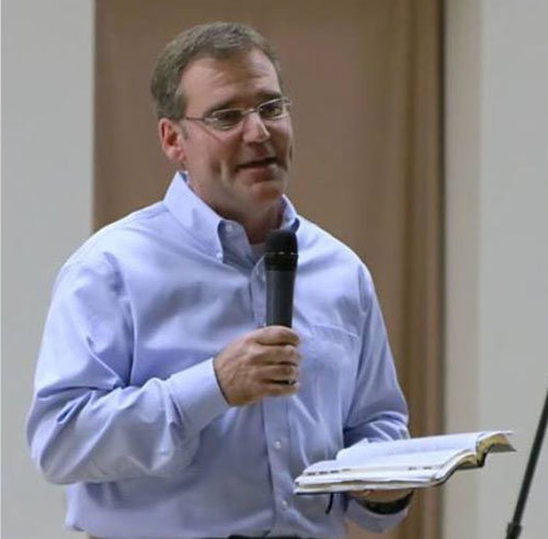 Jon Reed, evangelist, preaches. 
