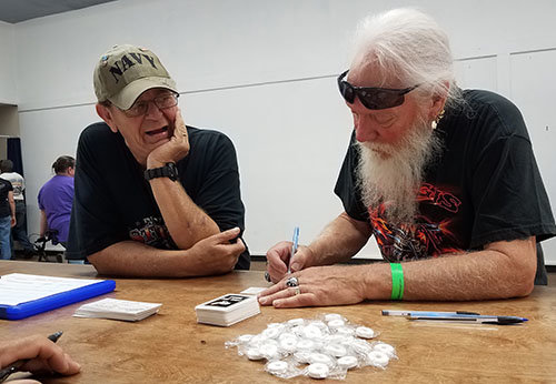A Sturgis Rally attendees signs up for the chance to win a free motorcycle.