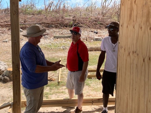 Henderson Hope, Greg Bentley, and a resident of Green Turtle Cay, Bahamas.