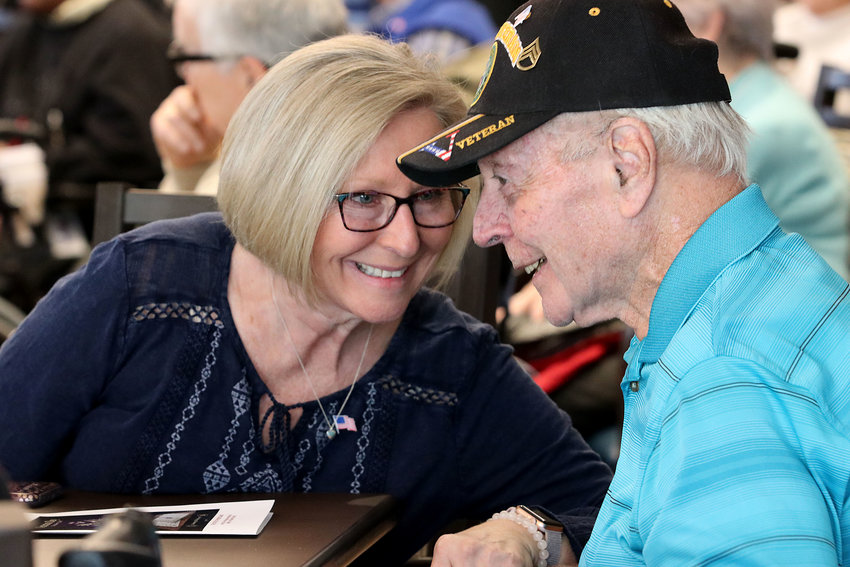 Diane Hamer shares a moment with her dad, Vietnam veteran Tom Roy during the annual Veteran's Day ceremony at the Rhode Island Veteran's Home in Bristol on Monday.