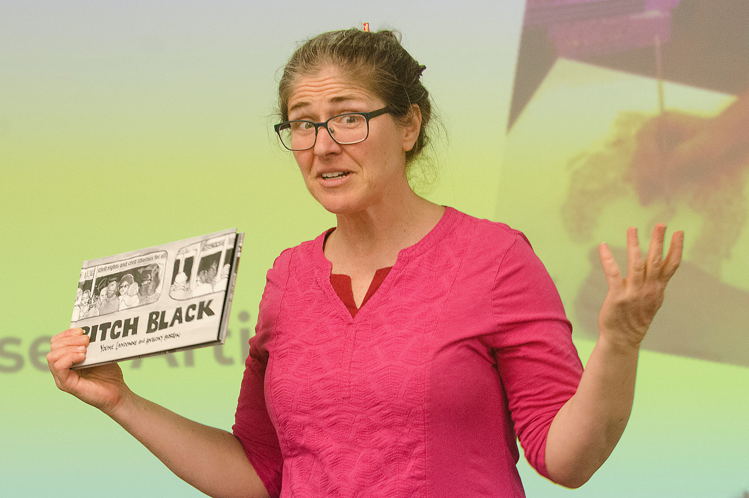 Author Youme Landowne holds a copy of her graphic novel, “Pitch Black: Don't Be Skerd,” which she co-wrote with Anthony Horton, a homeless artist who lived in the New York City subway system. She was speaking to Portsmouth Middle School students as part of the All Day Audible With Authors Event on Friday.