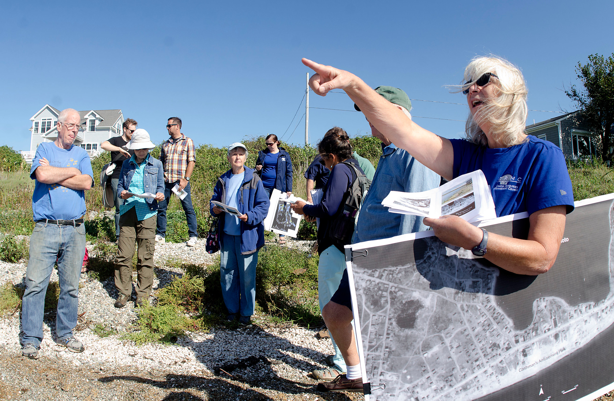 Janet Freedman, a coastal geologist with the R.I. Coastal Resources Management Council (CRMC), speaks about coastal flooding and erosion during a walking tour of Island Park Friday morning.