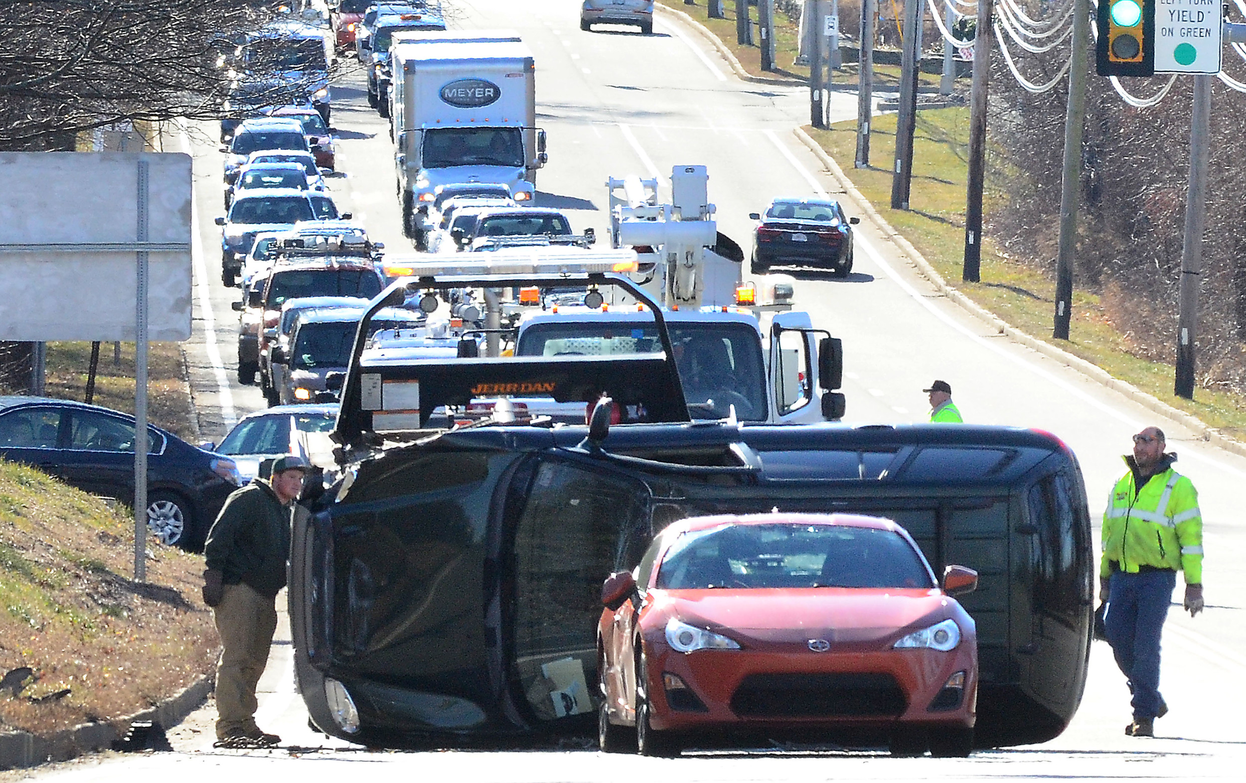 Two drivers injured, pole snapped in rollover crash in Portsmouth